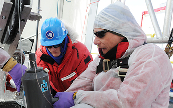 Brent C. Christner and Alex Michaud retrieve the first water sample from Lake Whillans.